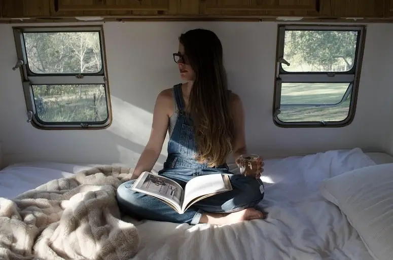 Girl Reading Book In RV