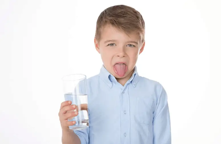 Boy Holding A Glass Of Water