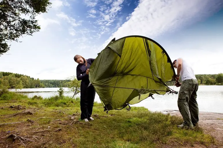 Couple Setting Up A Tent