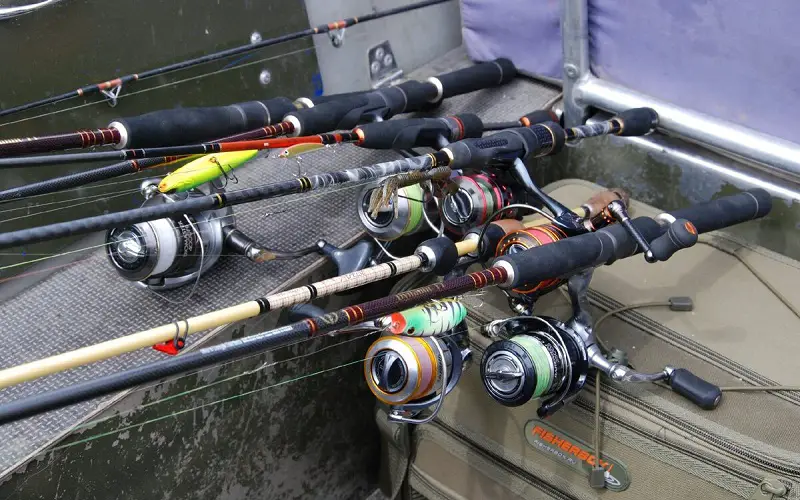 Spinning rods and reels on a side of the  boat