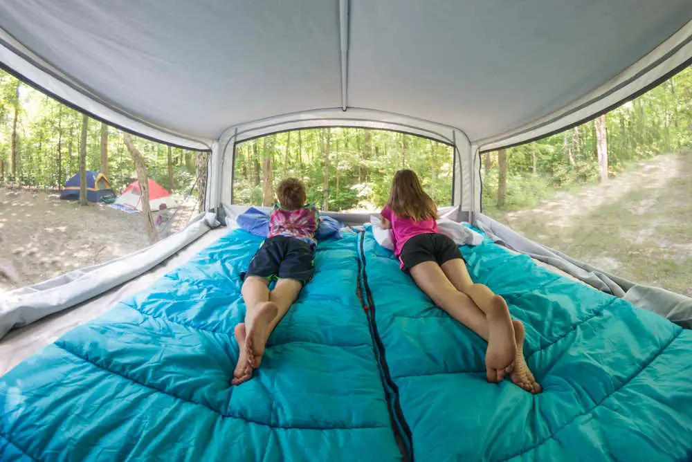 2 children inside a camper