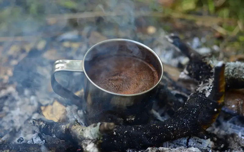 Making simple cowboy coffee oon campfire
