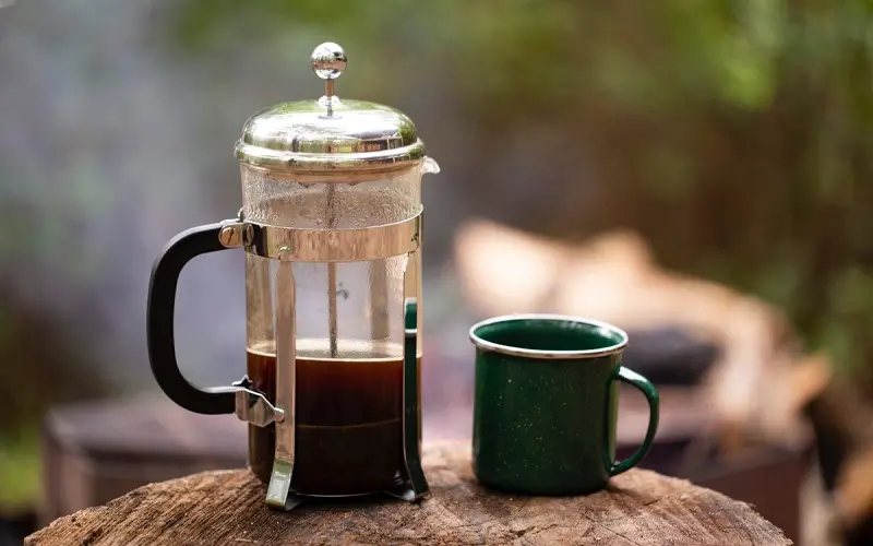 Making french press coffee while camping