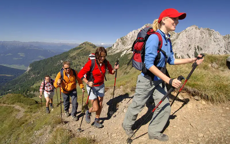 Young girl leads group of hikers