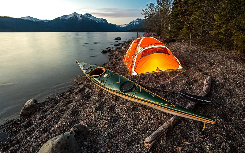 Camping with kayak by the lake
