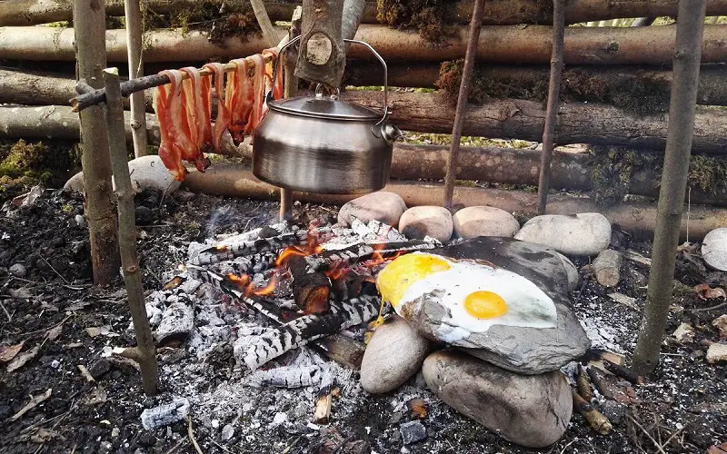 preparing food on campfire